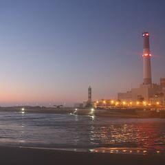 A power station on the coast at dusk
